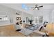 Bright and airy living room featuring vaulted ceilings, sliding glass doors, and wood-look flooring at 5426 Creeping Hammock Dr, Sarasota, FL 34231