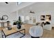Bright and airy living room with modern furnishings and light wood floors at 5426 Creeping Hammock Dr, Sarasota, FL 34231