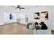 Bright living room featuring light wood floors and modern furnishings at 5426 Creeping Hammock Dr, Sarasota, FL 34231