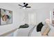 Comfortable main bedroom features wood flooring and a fan at 5426 Creeping Hammock Dr, Sarasota, FL 34231