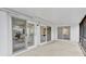 Covered patio features multiple sliding glass doors providing seamless indoor-outdoor living at 5426 Creeping Hammock Dr, Sarasota, FL 34231