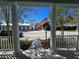 View from the porch featuring stately columns and railing with a view of the neighborhood street at 6116 Parkset Dr, Lithia, FL 33547