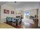 Bright living room featuring hardwood floors, modern lighting, and floor-to-ceiling windows at 628 Cleveland St # 1507, Clearwater, FL 33755