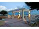 Inviting rooftop deck featuring a pergola, outdoor grill and lounge chairs at 628 Cleveland St # 1507, Clearwater, FL 33755