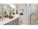 This primary bathroom features double sinks, a large mirror, and a decorative shower at 746 Steel Dr, Apollo Beach, FL 33572