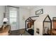 This cozy bedroom features a decorative play tent, striped curtains, and charming decor at 746 Steel Dr, Apollo Beach, FL 33572