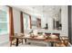 Dining area with a rustic wood table and seating for eight at 746 Steel Dr, Apollo Beach, FL 33572