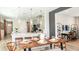 Open dining room with pendant lighting adjacent to kitchen at 746 Steel Dr, Apollo Beach, FL 33572