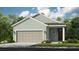 Charming one-story home showcasing a two-car garage and inviting front entrance at 746 Steel Dr, Apollo Beach, FL 33572