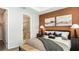 The main bedroom features an accent wall, neutral linens, and an attached primary bath at 746 Steel Dr, Apollo Beach, FL 33572