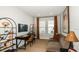 This home office features ample shelving, modern decor, and plenty of natural light at 746 Steel Dr, Apollo Beach, FL 33572