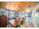 Charming living area featuring a wood ceiling, stylish furnishings, and tiled flooring at 7501 Hollowell Dr, Tampa, FL 33615