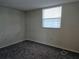 This bedroom features neutral walls, carpet, and a window with blinds for natural light at 7560 Bay Island S Dr # 144, South Pasadena, FL 33707