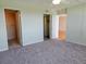 Bedroom with multiple closets, carpeting, and access to other rooms at 7560 Bay Island S Dr # 144, South Pasadena, FL 33707