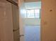 Bedroom with carpet, views, and bath access at 7560 Bay Island S Dr # 144, South Pasadena, FL 33707