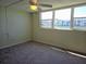 Cozy bedroom with a water view and a ceiling fan at 7560 Bay Island S Dr # 144, South Pasadena, FL 33707