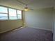 Bright bedroom featuring a scenic water view through large windows at 7560 Bay Island S Dr # 144, South Pasadena, FL 33707