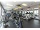 Bright gym with multiple treadmills, ellipticals and stationary bikes with mirrors at 7560 Bay Island S Dr # 144, South Pasadena, FL 33707