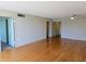 Inviting living room with bamboo floors and modern ceiling fan fixture at 7560 Bay Island S Dr # 144, South Pasadena, FL 33707