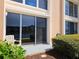 Enjoy water views from this condo patio with tropical plants and a sliding glass door at 7560 Bay Island S Dr # 144, South Pasadena, FL 33707