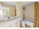 Cozy bathroom featuring a tub with shower and a vanity with sink at 9481 Highland Oak Dr # 1410, Tampa, FL 33647