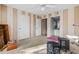 Striped bedroom with a ceiling fan, featuring a bathroom, closet, and windows at 9481 Highland Oak Dr # 1410, Tampa, FL 33647