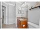 Bathroom showcasing a vanity with granite countertops and a large mirror at 10720 Rockledge View Dr, Riverview, FL 33579