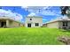 Expansive backyard with lush green grass, offering ample space for outdoor activities and relaxation at 10908 Carlton Fields Dr, Riverview, FL 33579