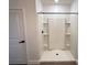 Bright bathroom featuring a shower with built-in shelving at 10908 Carlton Fields Dr, Riverview, FL 33579