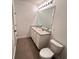 Modern bathroom featuring a double vanity with a sleek countertop, a large mirror, and updated fixtures at 10908 Carlton Fields Dr, Riverview, FL 33579
