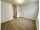 Bright bedroom with wood-look flooring, perfect for relaxing or working at 10908 Carlton Fields Dr, Riverview, FL 33579