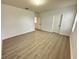This bedroom has light wood floors and modern white doors at 10908 Carlton Fields Dr, Riverview, FL 33579