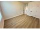 A clean and spacious bedroom featuring light wood floors, white walls, and a bright, airy atmosphere at 10908 Carlton Fields Dr, Riverview, FL 33579