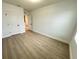 Spacious bedroom featuring light wood flooring, complemented by neutral walls and ample natural light at 10908 Carlton Fields Dr, Riverview, FL 33579