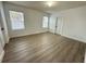 Bright bedroom showcasing modern white trim and two large windows at 10908 Carlton Fields Dr, Riverview, FL 33579