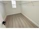 Walk-in closet with wire shelving and light wood floor at 10908 Carlton Fields Dr, Riverview, FL 33579