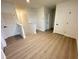 Upstairs hallway with wood-look flooring and access to bedrooms and bathrooms at 10908 Carlton Fields Dr, Riverview, FL 33579