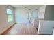 Bright upstairs hallway with wood look flooring, leading to bedrooms and storage at 10908 Carlton Fields Dr, Riverview, FL 33579