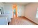 Bright upstairs hallway with wood look flooring, leading to bedrooms and storage at 10908 Carlton Fields Dr, Riverview, FL 33579