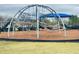 Community playground with a dome climber, slide, and swingset, offering safe and engaging play for children at 10908 Carlton Fields Dr, Riverview, FL 33579
