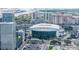 Expansive aerial shot of a city featuring a prominent arena, waterfront views, and surrounding buildings at 111 N 12Th St # 1819, Tampa, FL 33602