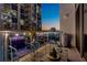 Balcony with skyline views features comfortable seating, glass railings and city lights at 111 N 12Th St # 1819, Tampa, FL 33602