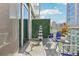 Balcony with city views features comfortable seating, glass railings, a privacy wall and decor at 111 N 12Th St # 1819, Tampa, FL 33602
