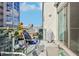 Balcony with cityscape views features comfortable seating, glass railings, and ample sunlight at 111 N 12Th St # 1819, Tampa, FL 33602