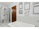 Modern bathroom featuring a bathtub, shower with glass door, and stylish wall decor at 111 N 12Th St # 1819, Tampa, FL 33602