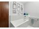 Clean bathroom with bathtub and a gray tiled wall at 111 N 12Th St # 1819, Tampa, FL 33602
