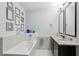 Bathroom with soaking tub and double vanity at 111 N 12Th St # 1819, Tampa, FL 33602