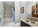 Bathroom featuring gray tile in the tub and stone countertops with stylish fixtures at 111 N 12Th St # 1819, Tampa, FL 33602