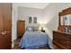 Cozy bedroom with wood flooring, vintage furniture, and natural lighting at 111 N 12Th St # 1819, Tampa, FL 33602