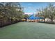 Dog park at condo complex featuring artificial turf, shade, and fencing at 111 N 12Th St # 1819, Tampa, FL 33602